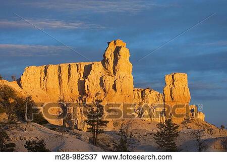 Stock Photo - Setting sun on cliffs of Bryce Canyon from Paria View, Bryce Canyon National Park Utah. Fotosearch