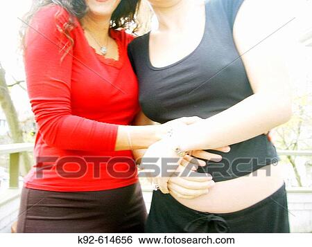 Seven-month pregnant woman and her best friend View Large Photo Image Stock Photograph - Seven-month pregnant woman and her best friend. Fotosearch