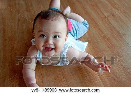 Seven months old smiling baby girl View Large Photo Image Stock Image - Seven months old smiling baby girl. Fotosearch