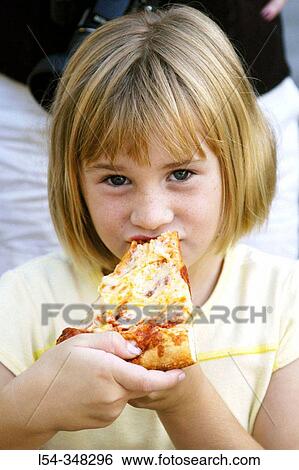 Seven year old girl eats pizza View Large Photo Image Stock Photograph - Seven year old girl eats pizza. Fotosearch