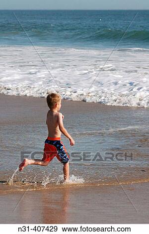 Seven years old child. Crystal Cove State Park. California. USA. View Large Photo Image Stock Photo - Seven years old child. Crystal Cove State Park. California. USA.. Fotosearch