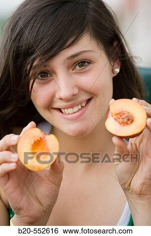 Seventeen year old girl eating fruit. View Large Photo Image Stock Photograph - Seventeen year old girl eating fruit.. Fotosearch