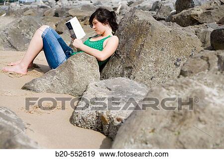 Seventeen year old girl reading at beach. View Large Photo Image Stock Photo - Seventeen year old girl reading at beach.. Fotosearch