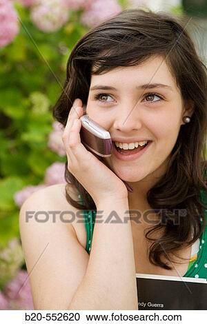Seventeen year old girl using mobile phone. View Large Photo Image Stock Image - Seventeen year old girl using mobile phone.. Fotosearch