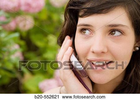 Seventeen year old girl using mobile phone. View Large Photo Image Stock Image - Seventeen year old girl using mobile phone.. Fotosearch
