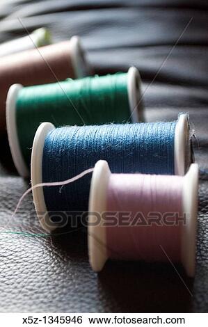 Several rolls of different colored thread View Large Photo Image Stock Photograph - Several rolls of different colored thread. Fotosearch
