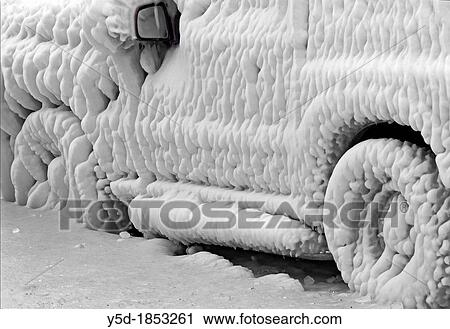 Severe winter, frozen car trapped in ice, Versoix, canton of Geneva, Lake Geneva shore, Switzerland, water was blown out from the lake by very strong wind, at very low temperature it got frozen immediately creating ice sculptures like this View Large Photo Image Stock Image - Severe winter, frozen car trapped in ice, Versoix, canton of Geneva, Lake Geneva shore, Switzerland, water was blown out from the lake by very strong wind, at very low temperature it got frozen immediately creating ice sculptures like this. Fotosearch