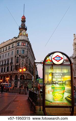 Stock Photography - Sevilla street and Metro entrance at dawn. Madrid, Spain.. Fotosearch
