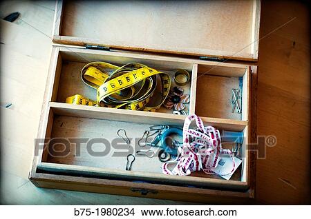 Sewing box with tape measure and safety pins View Large Photo Image Picture - Sewing box with tape measure and safety pins. Fotosearch