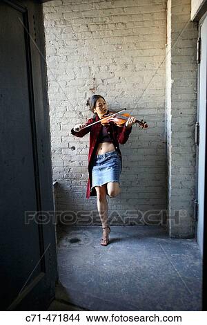 Sexy asian woman playing violin in stairwell View Large Photo Image Picture - Sexy asian woman playing violin in stairwell. Fotosearch
