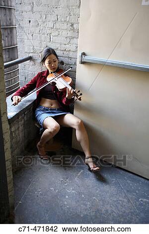 Sexy asian woman playing violin in staircase View Large Photo Image Stock Image - Sexy asian woman playing violin in staircase. Fotosearch