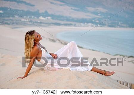 Sexy blonde woman lying on the beach View Large Photo Image Stock Image - Sexy blonde woman lying on the beach. Fotosearch