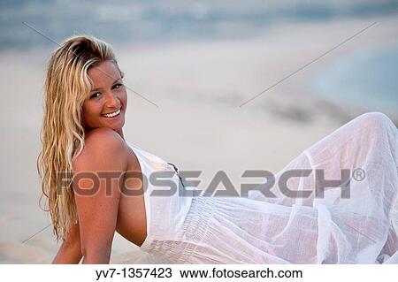 Sexy blonde woman lying on the beach View Large Photo Image Stock Image - Sexy blonde woman lying on the beach. Fotosearch
