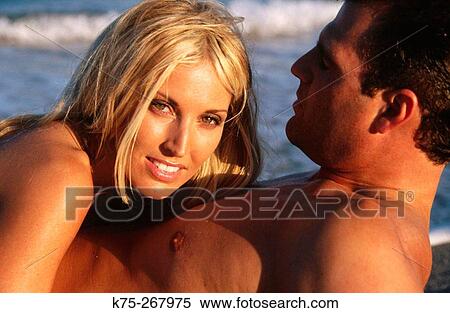 Sexy couple on the beach View Large Photo Image Stock Photography - Sexy couple on the beach. Fotosearch