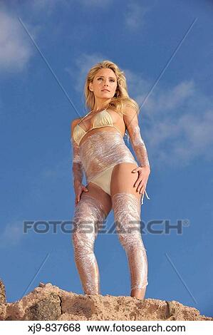 Sexy fashion girl looking the horizont at sunshine on the beach View Large Photo Image Stock Photo - Sexy fashion girl looking the horizont at sunshine on the beach. Fotosearch