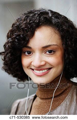 Stock Photography - Sexy hispanic woman smiling in camera. Fotosearch