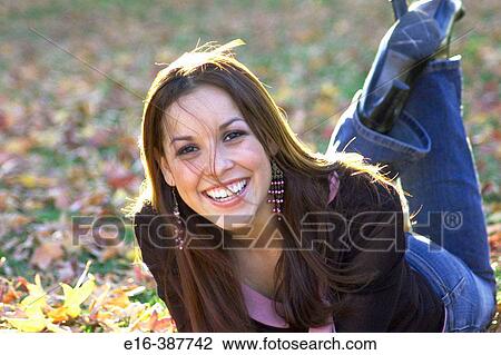 sexy Latin lady lying in aautumn leaves View Large Photo Image Stock Image - sexy Latin lady lying in aautumn leaves. Fotosearch
