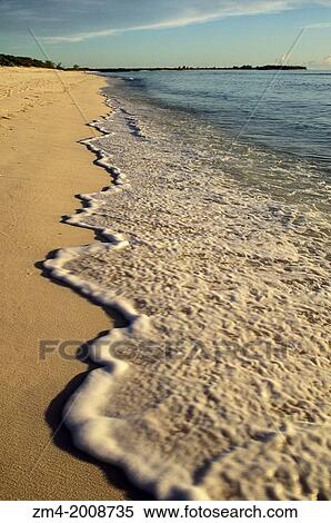 SEYCHELLES, ASSUMPTION ISLAND, SURF ON BEACH. View Large Photo Image Stock Photography - SEYCHELLES, ASSUMPTION ISLAND, SURF ON BEACH.. Fotosearch