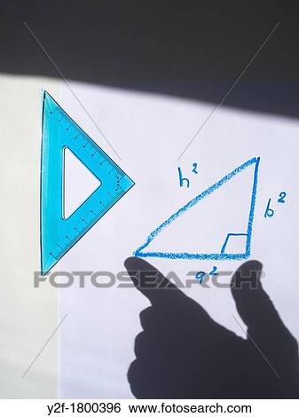 shadow hand measuring Pythagorean triangle drawn in blue crayon View Large Photo Image Stock Photograph - shadow hand measuring Pythagorean triangle drawn in blue crayon. Fotosearch