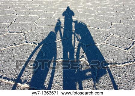 Shadow of a biker on the frozen salt lake called? Salar de Uyuni? in Bolivia View Large Photo Image Stock Image - Shadow of a biker on the frozen salt lake called? Salar de Uyuni? in Bolivia. Fotosearch