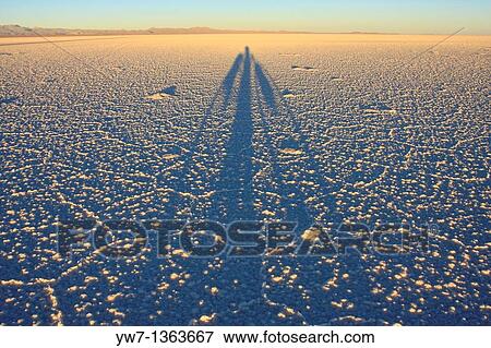 Shadow of a biker on the frozen salt lake called? Salar de Uyuni? in Bolivia View Large Photo Image Stock Photo - Shadow of a biker on the frozen salt lake called? Salar de Uyuni? in Bolivia. Fotosearch