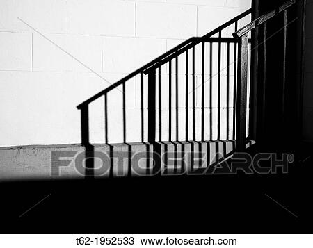 Stock Image - Shadow of a black and white staircase.. Fotosearch