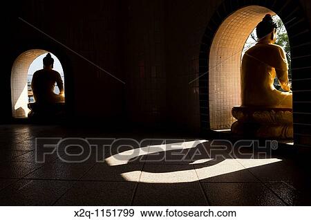 Shadow of a buddha statue at the ten thousand buddhas monastery Sha Tin Hong Kong China View Large Photo Image Stock Photo - Shadow of a buddha statue at the ten thousand buddhas monastery Sha Tin Hong Kong China. Fotosearch