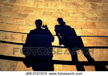 shadow of a couple walking Downteps and taking pictures, Puente del Mar, Valencia, Spain. View Large Photo Image Picture - shadow of a couple walking Downteps and taking pictures, Puente del Mar, Valencia, Spain.. Fotosearch