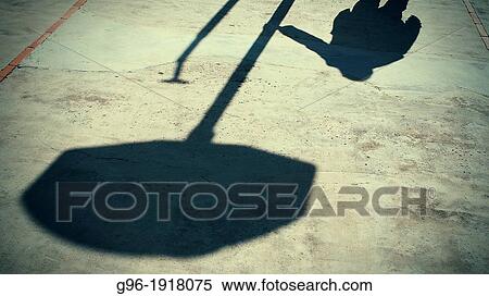 Shadow of an individual at a playground View Large Photo Image Stock Photography - Shadow of an individual at a playground. Fotosearch