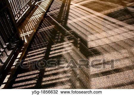 shadow of closed gate at night View Large Photo Image Stock Image - shadow of closed gate at night. Fotosearch