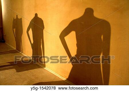 shadow of female mannequins at fashion event View Large Photo Image Stock Photo - shadow of female mannequins at fashion event. Fotosearch