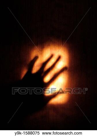 Shadow of hand on wooden door View Large Photo Image Stock Photography - Shadow of hand on wooden door. Fotosearch