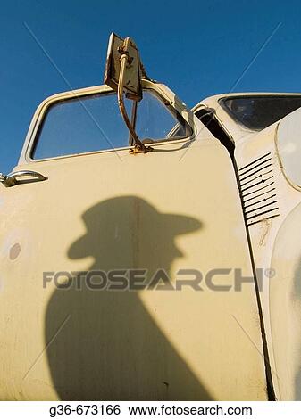 Stock Photograph - Shadow of man at farmer's market in Baywood Park, California. Fotosearch