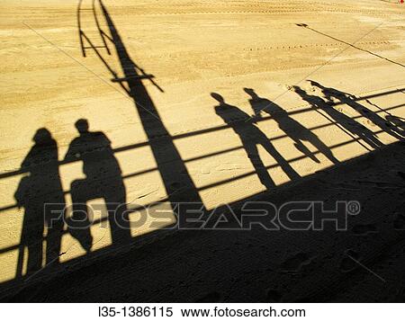 Shadows of people on the beach of La Palma, Spain. View Large Photo Image Stock Photography - Shadows of people on the beach of La Palma, Spain.. Fotosearch