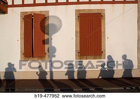 Stock Image - Shadows on wall, Saint-Jean-de-Luz. Aquitaine, France. Fotosearch