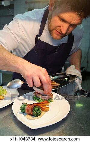 Picture - SHANE HUGHES, Michelin starred chef at Ynyshir Hall Hotel, preparing locally sourced food for lunch Ynyshir, Ceredigion, West Wales UK. Fotosearch
