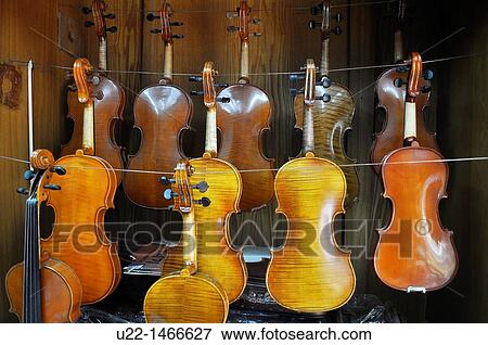 Stock Photo - Shanghai (China): Chinese violins, sold in a musical instruments shop in the Old Town. Fotosearch