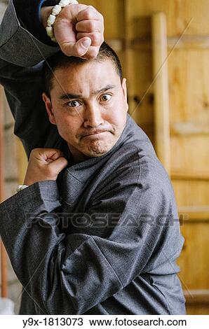 Shaolin Monk Shi De Jian demonstates traditional martial arts at the San Huang Zhai Monastery on the Song Mountain, China View Large Photo Image Stock Image - Shaolin Monk Shi De Jian demonstates traditional martial arts at the San Huang Zhai Monastery on the Song Mountain, China. Fotosearch