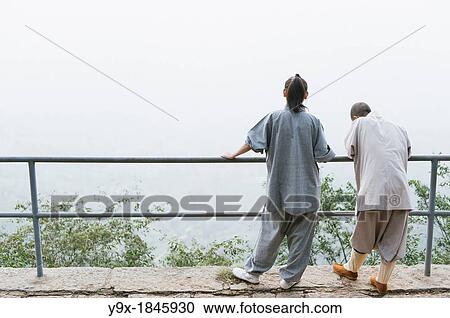 Shaolin nuns stand and perch at a railing at the statue of Bodhidharma at the Shaolin Temple View Large Photo Image Stock Image - Shaolin nuns stand and perch at a railing at the statue of Bodhidharma at the Shaolin Temple. Fotosearch