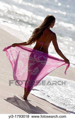 Shapely woman with sarong at the beach at Makena, Maui, Hawaii View Large Photo Image Stock Photo - Shapely woman with sarong at the beach at Makena, Maui, Hawaii. Fotosearch