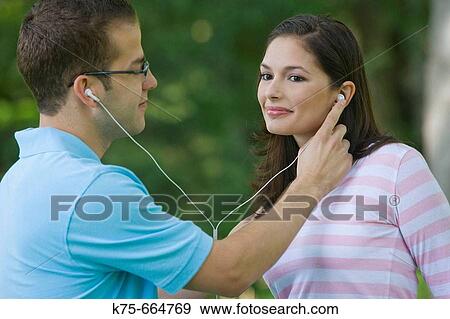 Sharing mp 3 player View Large Photo Image Stock Photo - Sharing mp 3 player. Fotosearch