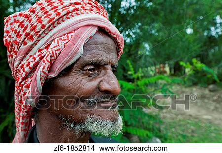 Picture - Shashemene Ethiopia Africa Alaba tribe portrait of local old man with red turban farmer and smile 9. Fotosearch