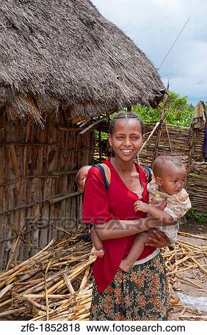 Shashemene Ethiopia Africa Alaba tribe home with animals and yard for locals with woman with her babies in poor farm 10 View Large Photo Image Stock Photo - Shashemene Ethiopia Africa Alaba tribe home with animals and yard for locals with woman with her babies in poor farm 10. Fotosearch