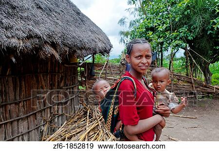 Shashemene Ethiopia Africa Alaba tribe home with animals and yard for locals with woman with her babies in poor farm 10 View Large Photo Image Stock Photo - Shashemene Ethiopia Africa Alaba tribe home with animals and yard for locals with woman with her babies in poor farm 10. Fotosearch