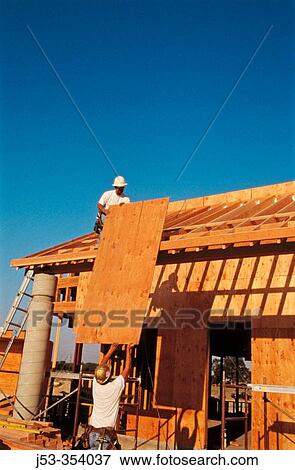 Sheeting a roof with plywood. East Antelope, California. USA. View Large Photo Image Stock Photo - Sheeting a roof with plywood. East Antelope, California. USA.. Fotosearch