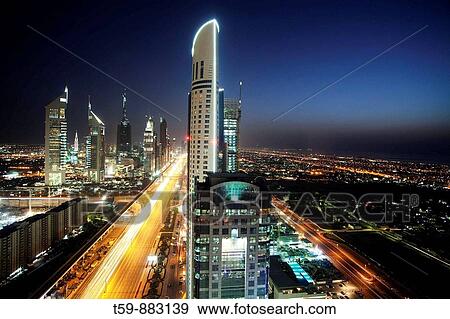 Sheikh Zayed Road at dusk, Dubai, United Arabian Emirates View Large Photo Image Stock Photo - Sheikh Zayed Road at dusk, Dubai, United Arabian Emirates. Fotosearch