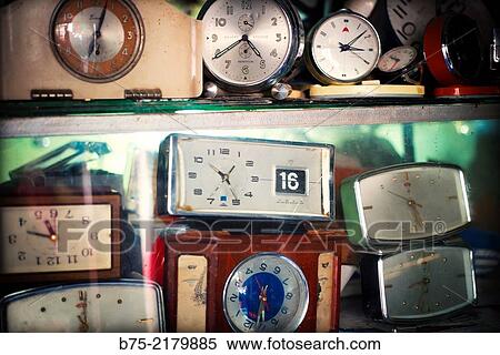 Stock Photography - Shelves full of watches in a watchmaker to be repair in the Medina of Fez, Morocco, Africa.. Fotosearch