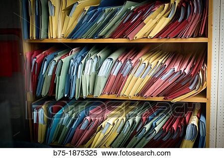 shelves with many colors folder, Spotlight View Large Photo Image Stock Photography - shelves with many colors folder, Spotlight. Fotosearch