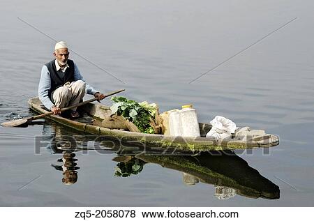 Shikara or house boat in Dal lake, Srinagar, Jammu & Kashmir, India. View Large Photo Image Stock Photo - Shikara or house boat in Dal lake, Srinagar, Jammu & Kashmir, India.. Fotosearch