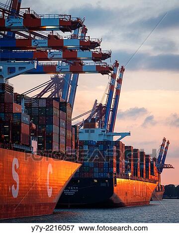 Ships at the Eurogate and Burchardkai container terminals in the port of Hamburg, Germany, at sunset. View Large Photo Image Stock Photo - Ships at the Eurogate and Burchardkai container terminals in the port of Hamburg, Germany, at sunset.. Fotosearch